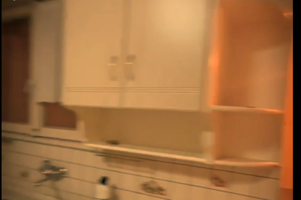 Kitchen before renovation, sink wall