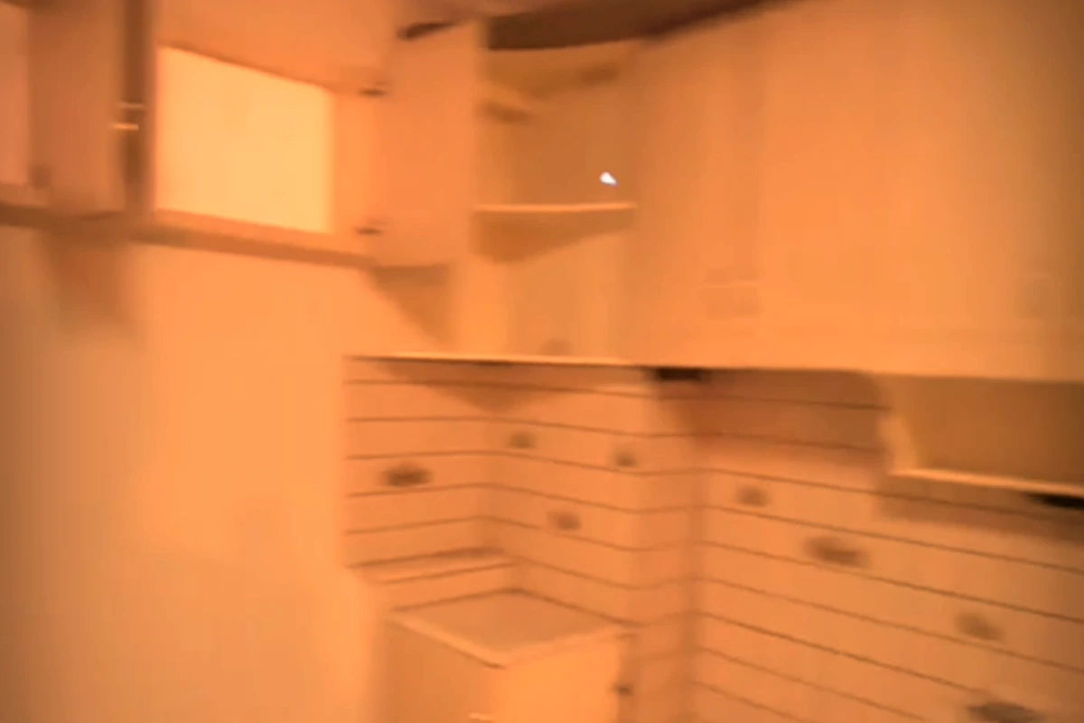 Kitchen before renovation, corner view