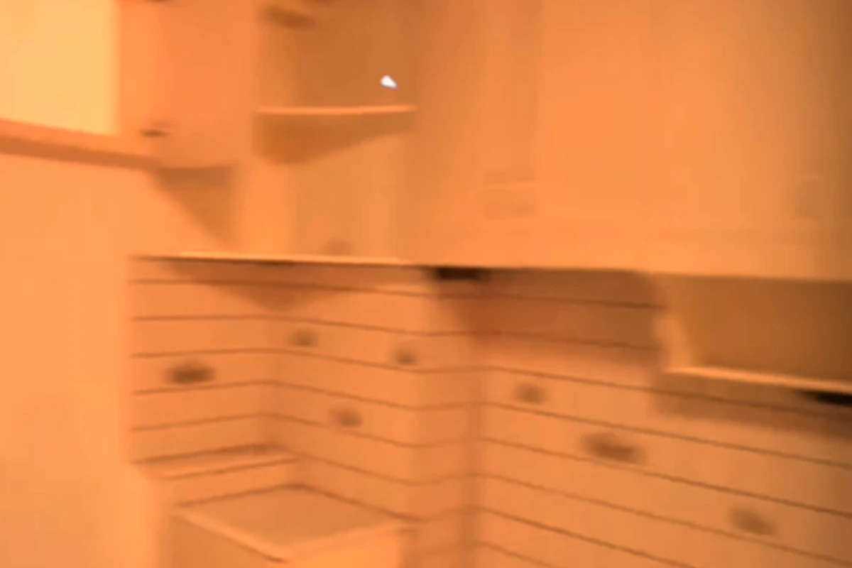 Kitchen before renovation, storage area